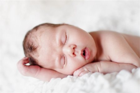 Newborn baby sleeping. Soft focus, shallow DoF. Photographie de stock - Aubaine LD & Abonnement, Code: 400-04787511