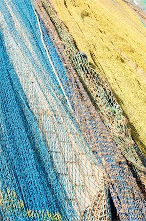 doca seca - Trawl fishing nets drying on a pier Foto de stock - Royalty-Free Super Valor e Assinatura, Número: 400-04787991