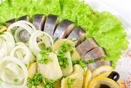 simsearch:400-08832368,k - Tasty herring with potato and fresh vegetables Stock Photo - Budget Royalty-Free & Subscription, Code: 400-04788340