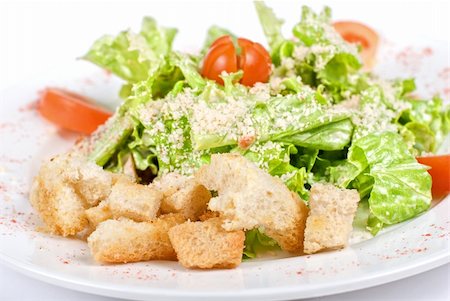 simsearch:400-05351290,k - Caesar salad dish closeup isolated on a white background Foto de stock - Super Valor sin royalties y Suscripción, Código: 400-04788364