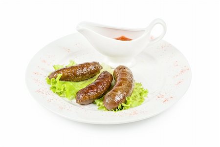 simsearch:400-04573343,k - grilled venison sausage on a white with lettuce and sauce Photographie de stock - Aubaine LD & Abonnement, Code: 400-04788514