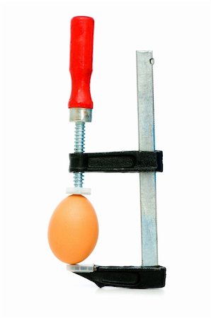 Strength concept with egg and clamp on white Stock Photo - Budget Royalty-Free & Subscription, Code: 400-04789231