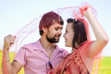 Young happy couple on the field. Shoot on the nature. Foto de stock - Super Valor sin royalties y Suscripción, Código: 400-04789386