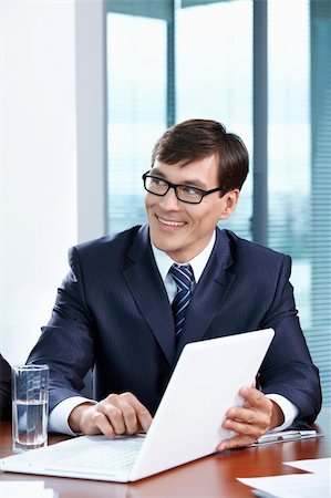 simsearch:400-04322314,k - Portrait of the businessman with the laptop at office Stock Photo - Budget Royalty-Free & Subscription, Code: 400-04789478