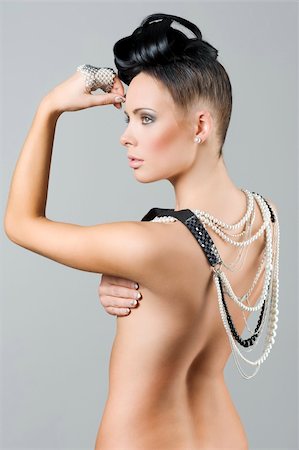 simsearch:400-04107736,k - sensual naked brunette with creative hair style covering her back with lots of necklace Stock Photo - Budget Royalty-Free & Subscription, Code: 400-04789731