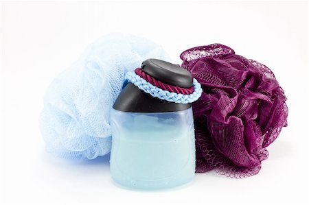 Purple and blue bath sponge and shower gel on white Stock Photo - Budget Royalty-Free & Subscription, Code: 400-04789832