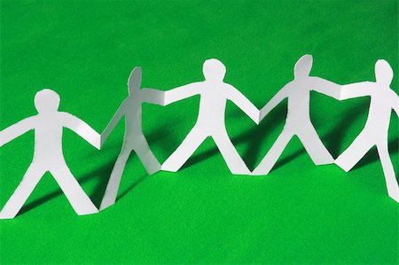 paper cutout chain - paper people doing teamwork in their business Stock Photo - Budget Royalty-Free & Subscription, Code: 400-04789976