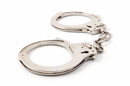 police handcuffs isolated on a white background Stock Photo - Budget Royalty-Free & Subscription, Code: 400-04780063