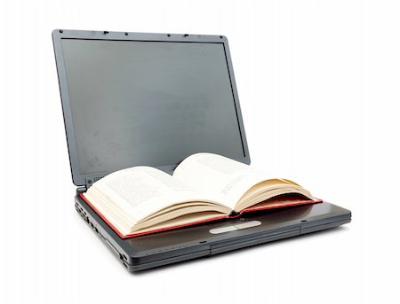 simsearch:400-07570955,k - The open book laying on the laptop isolated on white Stock Photo - Budget Royalty-Free & Subscription, Code: 400-04780263