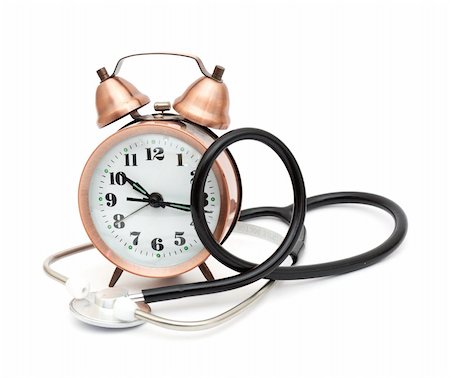 Stethoscope and alarm clock isolated on white background Photographie de stock - Aubaine LD & Abonnement, Code: 400-04780289
