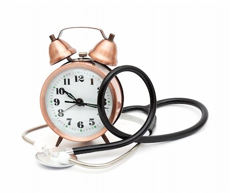 Stethoscope and alarm clock isolated on white background Fotografie stock - Microstock e Abbonamento, Codice: 400-04780289