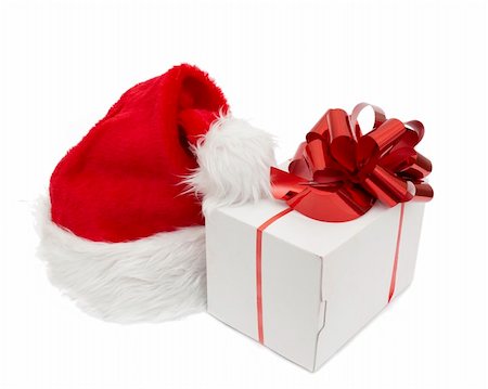 simsearch:400-07179884,k - Santa hat and giftisolated on white background Photographie de stock - Aubaine LD & Abonnement, Code: 400-04780297