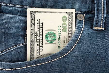 simsearch:400-06102745,k - A one hundred dollar note in the front pocket of denim trousers Photographie de stock - Aubaine LD & Abonnement, Code: 400-04780427