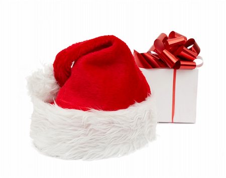 simsearch:400-05301621,k - Santa hat and giftisolated on white background Foto de stock - Super Valor sin royalties y Suscripción, Código: 400-04780551