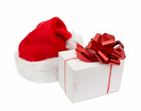 simsearch:400-04657079,k - Santa hat and giftisolated on white background Fotografie stock - Microstock e Abbonamento, Codice: 400-04780552