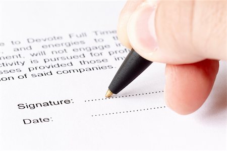 signature on paper with pen and hand - Closeup of a letter signature Stock Photo - Budget Royalty-Free & Subscription, Code: 400-04780887