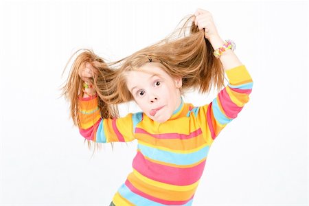 studio shot of pretty little girl with a fun grimace Foto de stock - Super Valor sin royalties y Suscripción, Código: 400-04780902