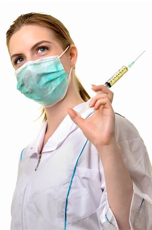young nurse preparing for injection isolated against white background Stock Photo - Budget Royalty-Free & Subscription, Code: 400-04781386