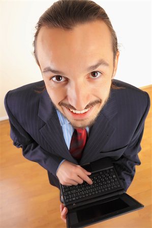simsearch:400-04782141,k - Businessman with laptop in hands. Stock Photo - Budget Royalty-Free & Subscription, Code: 400-04782145
