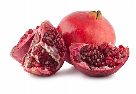 simsearch:400-05196174,k - Fresh full and opened pomegranate on white background Photographie de stock - Aubaine LD & Abonnement, Code: 400-04782848