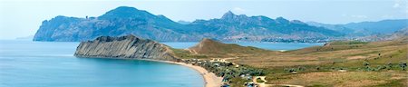 Summer rocky coastline and camping on sandy beach (Tihaja Bay (Koktebel Town on right), Crimea, Ukraine ). All peoples and cars is aunrecognizable. Four shots stitch image. Foto de stock - Royalty-Free Super Valor e Assinatura, Número: 400-04783171