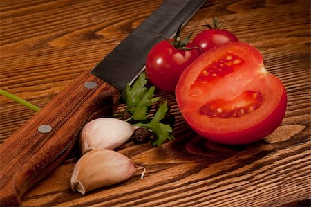 simsearch:400-05292254,k - Tomatoes on the old wooden table Photographie de stock - Aubaine LD & Abonnement, Code: 400-04783871