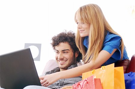 a young couple  using his credit card to purchase over the internet, happiness and amazement Stock Photo - Budget Royalty-Free & Subscription, Code: 400-04783898