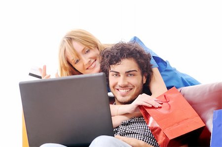 a young couple using his credit card to purchase over the internet, happiness and amazement Stock Photo - Budget Royalty-Free & Subscription, Code: 400-04783899