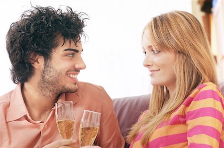 young couple smiling and drinking together Stock Photo - Budget Royalty-Free & Subscription, Code: 400-04783909