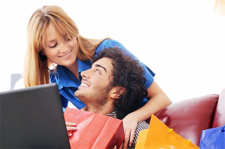 a young couple  using his credit card to purchase over the internet, happiness and amazement Stock Photo - Budget Royalty-Free & Subscription, Code: 400-04783900