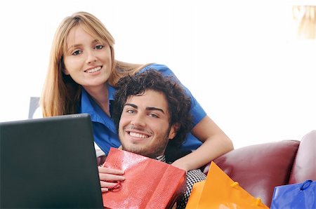 a young couple  using his credit card to purchase over the internet, happiness and amazement Stock Photo - Budget Royalty-Free & Subscription, Code: 400-04783901