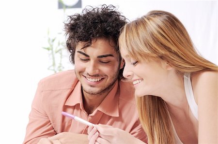 young couple smiling for pregnancy test, parental and couple love Stock Photo - Budget Royalty-Free & Subscription, Code: 400-04783916