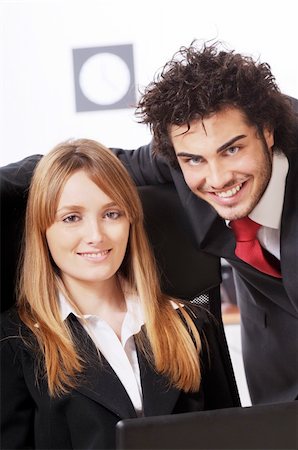 worker couple uses laptop in the office Stock Photo - Budget Royalty-Free & Subscription, Code: 400-04783919