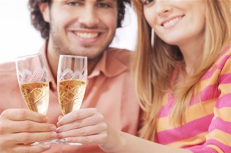 young couple smiling and drinking together Stock Photo - Budget Royalty-Free & Subscription, Code: 400-04783911