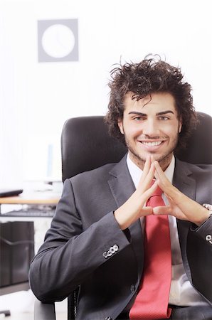 businessman in the office, smiling and looking in camera Stock Photo - Budget Royalty-Free & Subscription, Code: 400-04783921