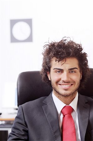 businessman in the office, smiling and looking in camera Stock Photo - Budget Royalty-Free & Subscription, Code: 400-04783922