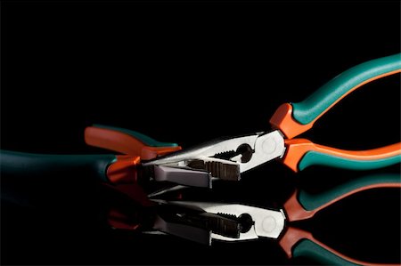 simsearch:400-05058869,k - locked flat nose and needle nose pliers on black background Foto de stock - Royalty-Free Super Valor e Assinatura, Número: 400-04794487
