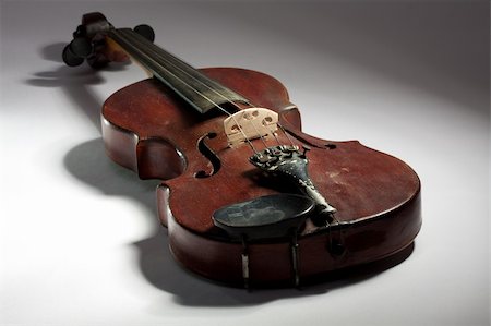 extremely old scratched violin on light background Stock Photo - Budget Royalty-Free & Subscription, Code: 400-04794644