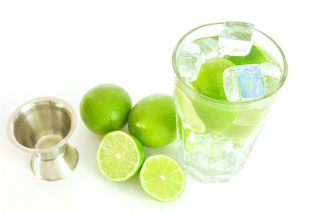 simsearch:400-04787910,k - Caipirinha cocktail with green lemon and ice cubes Stock Photo - Budget Royalty-Free & Subscription, Code: 400-04794858