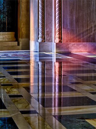 simsearch:400-05327535,k - Colorful light from a stained glass window in a cathedral falls on the polished marble of the church illuminating the carved pillars and reflecting in floor Photographie de stock - Aubaine LD & Abonnement, Code: 400-04795503