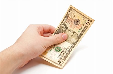 Hand holds a 10 dollar bill on white background Stock Photo - Budget Royalty-Free & Subscription, Code: 400-04795533