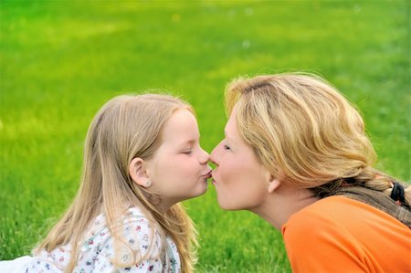 simsearch:400-04795754,k - Mother is kissing her daughter Stock Photo - Budget Royalty-Free & Subscription, Code: 400-04795754