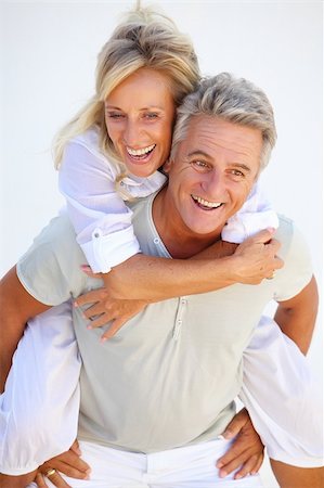 Happy mature couple having fun over white background. Photographie de stock - Aubaine LD & Abonnement, Code: 400-04795885