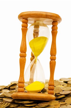 Time is money concept - hourglass and coins Stock Photo - Budget Royalty-Free & Subscription, Code: 400-04796833