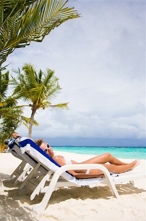 simsearch:628-00919233,k - Lady relaxing in the chaise lounge on a exotic resort Stock Photo - Budget Royalty-Free & Subscription, Code: 400-04796884