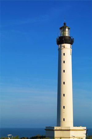 white lighthouse, blue sky, beacon Stock Photo - Budget Royalty-Free & Subscription, Code: 400-04796981