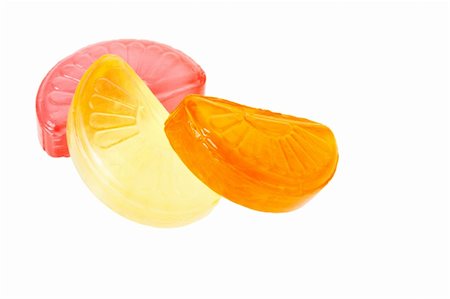 Fruit drop lemon, orange and grapefruit sections isolated on white Stock Photo - Budget Royalty-Free & Subscription, Code: 400-04797063