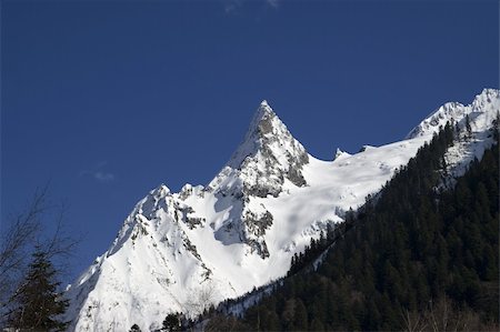 simsearch:400-04259396,k - Mountain peak. Caucasus Mountains. Dombay, peak Ine. Fotografie stock - Microstock e Abbonamento, Codice: 400-04797155