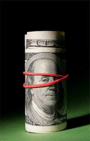 franklin - 100 Dollar roll tightened with red rubber band. Stock Photo - Budget Royalty-Free & Subscription, Code: 400-04797829