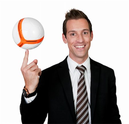 Businessman spinning soccer ball on the finger. Isolated on white Stock Photo - Budget Royalty-Free & Subscription, Code: 400-04798295